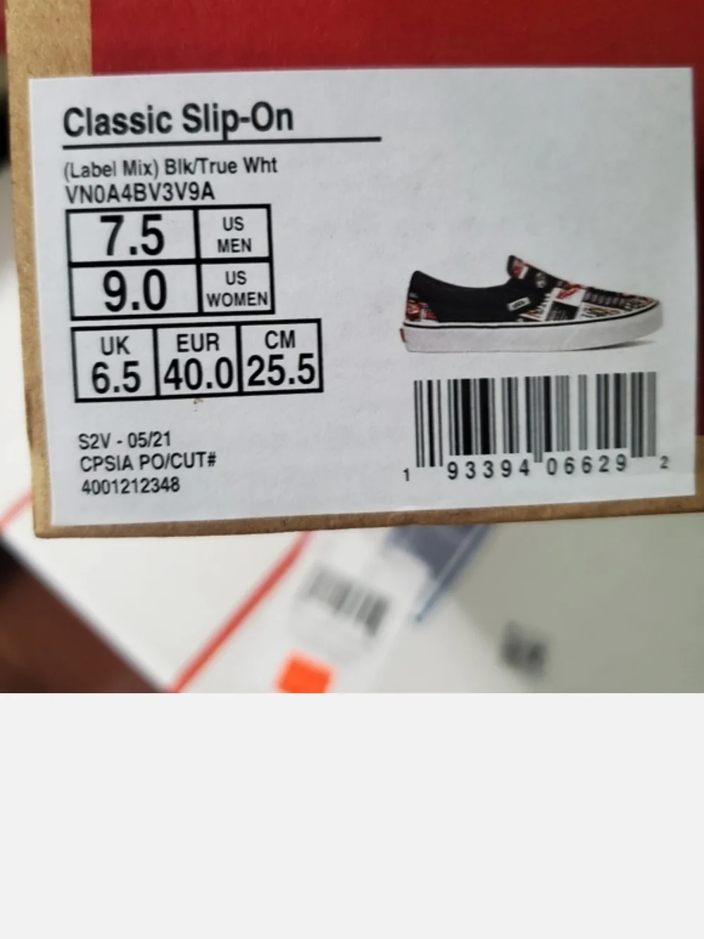 Vans Black Slip-On Sneakers with Red, White & Yellow Logo Print